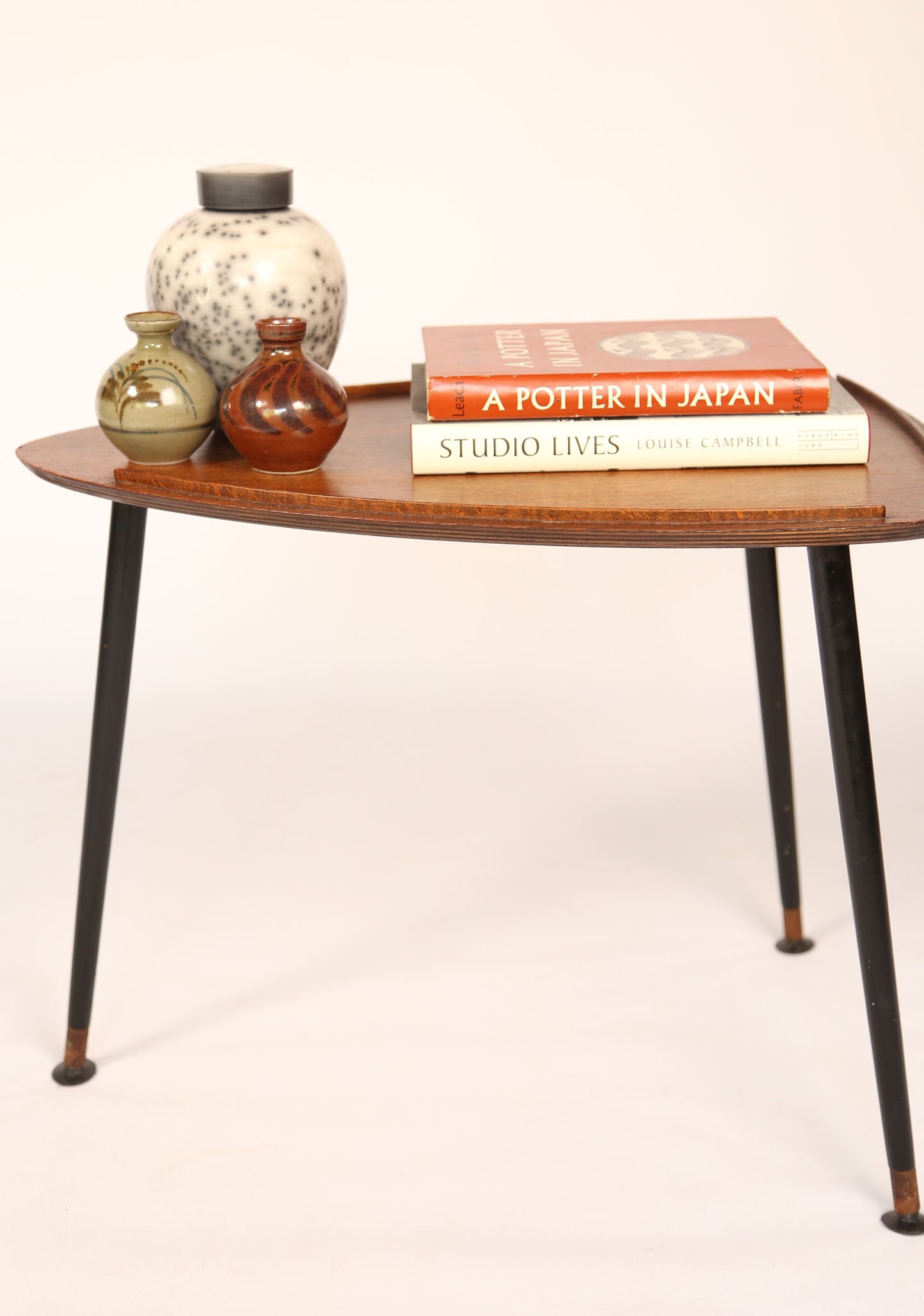 Pair of 1950s oak shield-shaped occassional tables on black tapered legs