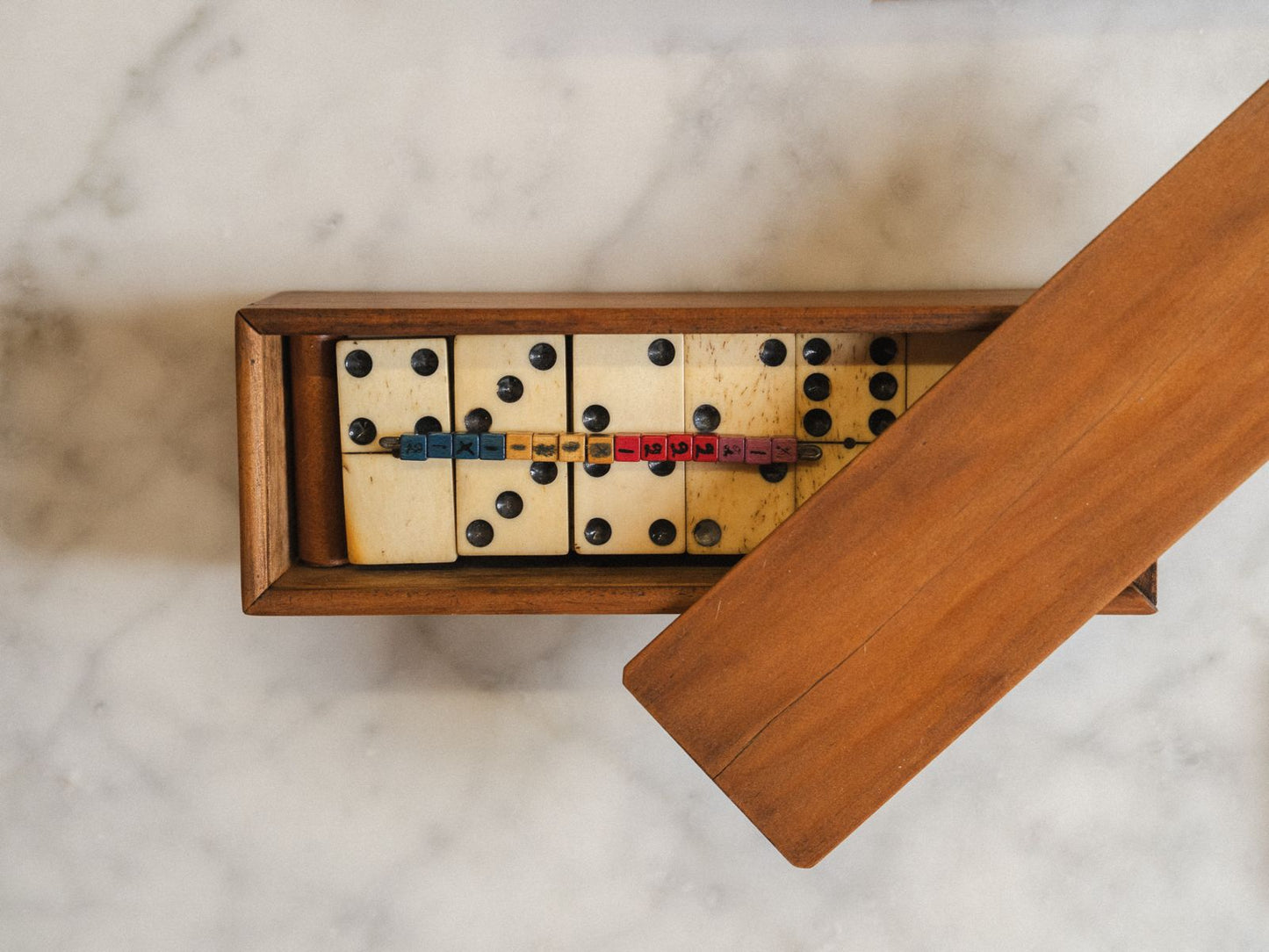 Early 20th-Century Bone & Ebony Domino Set with mahogany slide top box