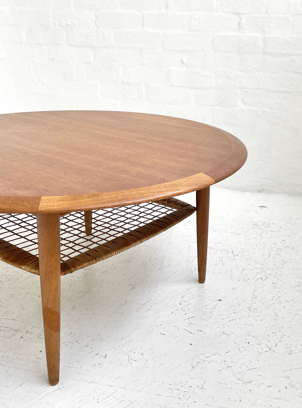 Circular teak and wicker coffee table w by Johannes Andersen (1960s)
