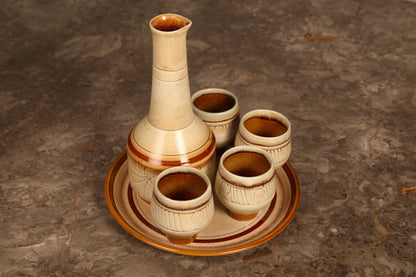 Celtic Pottery decanter with tray and 4 beakers in 'Medallion' design (1960s) Cornwall