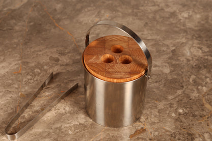 Arne Jacobsen for Stelton, a stainless steel 1960s ice bucket and tongs with teak lid (1960s) Denmark